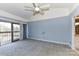 Bright bedroom with ceiling fan and sliding glass doors to outdoor balcony at 84 Ridgeport Rd # B, Clover, SC 29710