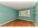 Bedroom with parquet floors, blue walls, glass shelves and natural light at 84 Ridgeport Rd # B, Clover, SC 29710