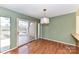 Cozy dining area adjacent to sliding doors to an outdoor deck and stylish pendant lighting at 84 Ridgeport Rd # B, Clover, SC 29710