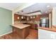 Modern kitchen features updated appliances, tiled backsplash, breakfast bar and wood floors at 84 Ridgeport Rd # B, Clover, SC 29710