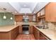 Well-equipped kitchen featuring tile backsplash, stainless appliances, and wood cabinets at 84 Ridgeport Rd # B, Clover, SC 29710