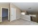 Second floor landing with neutral carpet leading to bedroom at 84 Ridgeport Rd # B, Clover, SC 29710