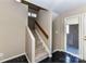 Neutral toned stairwell with carpeted steps and dark tile entry at 84 Ridgeport Rd # B, Clover, SC 29710