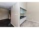 Living room featuring wet bar with granite countertops, ample cabinet storage and glass shelving at 84 Ridgeport Rd # B, Clover, SC 29710