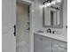 Updated bathroom featuring a sleek vanity with sink, cabinet, and patterned tile floors at 9414 Machado Dr, Indian Trail, NC 28079