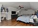 This bedroom is designed with wood floors, black bedroom furniture, and decorated with football memorabilia at 9414 Machado Dr, Indian Trail, NC 28079
