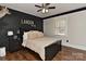 The bedroom boasts a sophisticated black accent wall with custom lettering at 9414 Machado Dr, Indian Trail, NC 28079