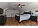 This bedroom is designed with wood floors, black bedroom furniture, and decorated with football memorabilia at 9414 Machado Dr, Indian Trail, NC 28079