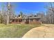 Charming brick home with a welcoming front porch and well-maintained front yard at 9414 Machado Dr, Indian Trail, NC 28079