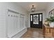 Welcoming foyer with bench seating, coat hooks, and stylish lighting at 9414 Machado Dr, Indian Trail, NC 28079
