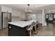 Spacious kitchen with a large island and bar seating, perfect for casual dining and gatherings at 9414 Machado Dr, Indian Trail, NC 28079