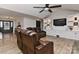 Spacious living room with a built-in entertainment center and comfortable leather seating at 9414 Machado Dr, Indian Trail, NC 28079