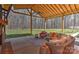 Relaxing covered patio featuring ceiling fans, and comfortable wicker furniture at 9414 Machado Dr, Indian Trail, NC 28079