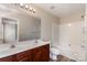 Full bathroom featuring double sink vanity, generous mirror and a shower-tub combination at 9534 Blossom Hill Dr, Huntersville, NC 28078
