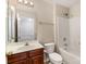 Bathroom featuring modern vanity, a mirror and a shower-tub combination at 9534 Blossom Hill Dr, Huntersville, NC 28078