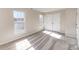 Bedroom with two windows and carpet at 9534 Blossom Hill Dr, Huntersville, NC 28078