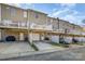 Exterior view of townhome featuring balconies, attached garages, and private parking at 9534 Blossom Hill Dr, Huntersville, NC 28078