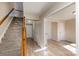Inviting foyer with hardwood floors, staircase with carpet runner, and ample natural light creating a warm welcome at 9534 Blossom Hill Dr, Huntersville, NC 28078