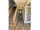 Welcoming foyer showcasing hardwood floors, staircase, and an open doorway at 9534 Blossom Hill Dr, Huntersville, NC 28078