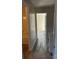 Hallway with access to the bathroom and bedroom with new carpeted flooring and neutral walls at 9534 Blossom Hill Dr, Huntersville, NC 28078