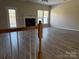 Bright living room with hardwood floors, fireplace, and plenty of natural light at 9534 Blossom Hill Dr, Huntersville, NC 28078