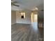 Open-concept living room with hardwood floors and view into other rooms at 9534 Blossom Hill Dr, Huntersville, NC 28078