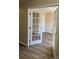 Bright office space featuring hardwood floors and elegant French doors at 9534 Blossom Hill Dr, Huntersville, NC 28078