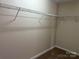Walk-in closet with wire shelving and carpeted flooring, ready for organizing your wardrobe at 9534 Blossom Hill Dr, Huntersville, NC 28078
