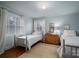 Cozy bedroom with hardwood floors, two twin beds and natural light at 1120 Cumberland Ave, Gastonia, NC 28054