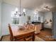 Inviting dining room featuring a wooden table, chairs, and natural light at 1120 Cumberland Ave, Gastonia, NC 28054