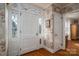 Charming entryway features classic wallpaper, hardwood floors, and a bright, inviting front door with sidelights at 1120 Cumberland Ave, Gastonia, NC 28054