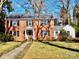 Charming red brick two-story home with black shutters and a well-manicured lawn at 1120 Cumberland Ave, Gastonia, NC 28054