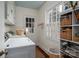 Functional laundry room with washer, dryer, built-in storage, and natural light at 1120 Cumberland Ave, Gastonia, NC 28054