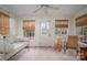Cozy sunroom with white walls, bright windows, and cozy furniture providing a tranquil space to relax at 1120 Cumberland Ave, Gastonia, NC 28054