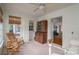 Cozy sunroom with bright natural light, neutral walls, and simple, comfortable seating at 1120 Cumberland Ave, Gastonia, NC 28054