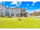 A large, beautiful backyard with a screened-in porch offers comfortable outdoor living at 118 Golden Trl, Mooresville, NC 28115