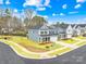 New construction two-story home featuring a manicured lawn and a welcoming front porch at 118 Golden Trl, Mooresville, NC 28115