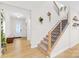 Bright foyer showcasing a modern staircase, natural light, and stylish decor at 118 Golden Trl, Mooresville, NC 28115