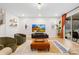 Modern living room with hardwood floors, stylish seating, and a view of the outdoor space at 118 Golden Trl, Mooresville, NC 28115