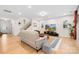 Spacious living room with sleek hardwood floors, modern decor, and staircase views at 118 Golden Trl, Mooresville, NC 28115