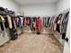 A spacious walk-in closet with carpeted floors has wire shelving for ample storage of clothing and other items at 118 Golden Trl, Mooresville, NC 28115