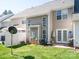 Exterior view of the backyard, including a green lawn, white fence and patio at 11907 Maria Ester Ct, Charlotte, NC 28277