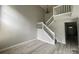 Inviting entryway with stairway and modern flooring creates a grand sense of arrival at 11907 Maria Ester Ct, Charlotte, NC 28277