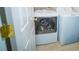 Bright laundry room featuring a white front-load washer and dryer set at 11907 Maria Ester Ct, Charlotte, NC 28277