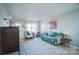 Inviting living room featuring hardwood floors, lots of natural light, and stylish furnishings at 11907 Maria Ester Ct, Charlotte, NC 28277