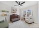 Bright Bedroom featuring a ceiling fan, carpeted floors, and a window that provides a great view at 125 Round Tuit Ln, Mt Ulla, NC 28125
