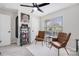 Bedroom with a neutral color palette featuring two leather chairs and a bookshelf with books at 125 Round Tuit Ln, Mt Ulla, NC 28125