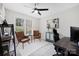Bright bedroom featuring modern fan, stylish chairs, and a decorative accent cabinet at 125 Round Tuit Ln, Mt Ulla, NC 28125