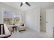 This Bedroom features a ceiling fan, carpeted floors, a window, and a white chair with a teddy bear on it at 125 Round Tuit Ln, Mt Ulla, NC 28125