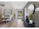 Open-concept dining area with stylish furnishings, hardwood floors, and abundant natural light at 125 Round Tuit Ln, Mt Ulla, NC 28125